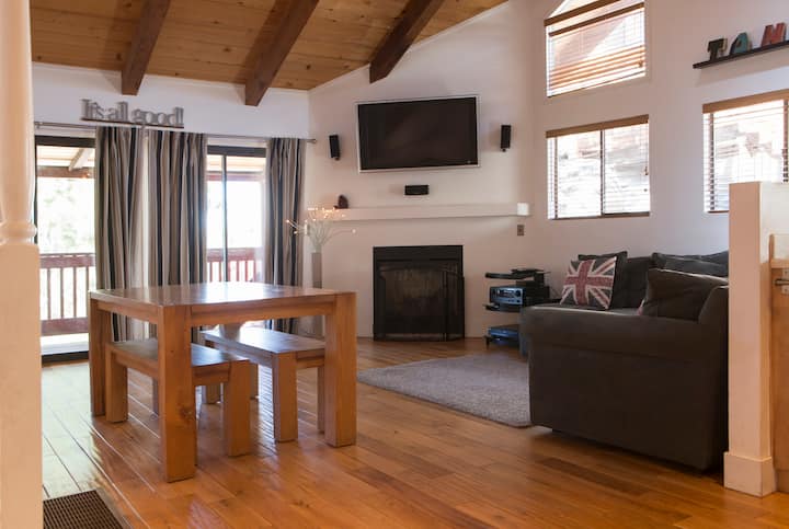 Living room seating area with couch, armchair and rug