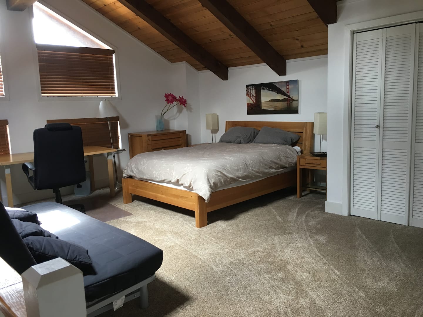 Loft with a full bedroom set and a pull-out double futon under the eaves