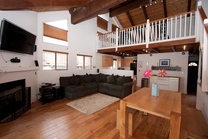 View from the loft railing down over the living area