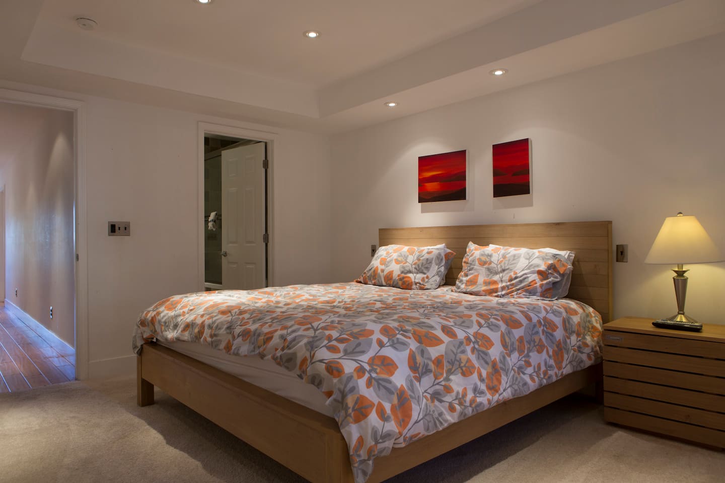 Master bedroom with a California King bed and built-in closets