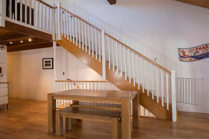 Wooden staircase leading up to the loft
